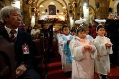 Niños en misa en una parroquia oficial -no clandestina- de Pekín, donde hay algo más de libertad que en otras regiones chinas