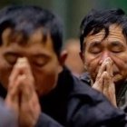 Dos católicos rezando en China