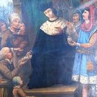 San Ivo, inclinado ante el pobre.