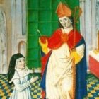 San Agustín le muestra su corazón trasverberado.