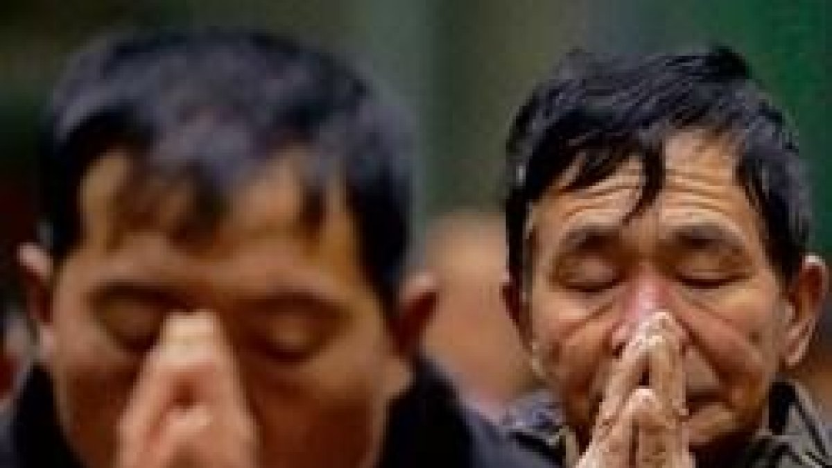 Dos católicos rezando en China
