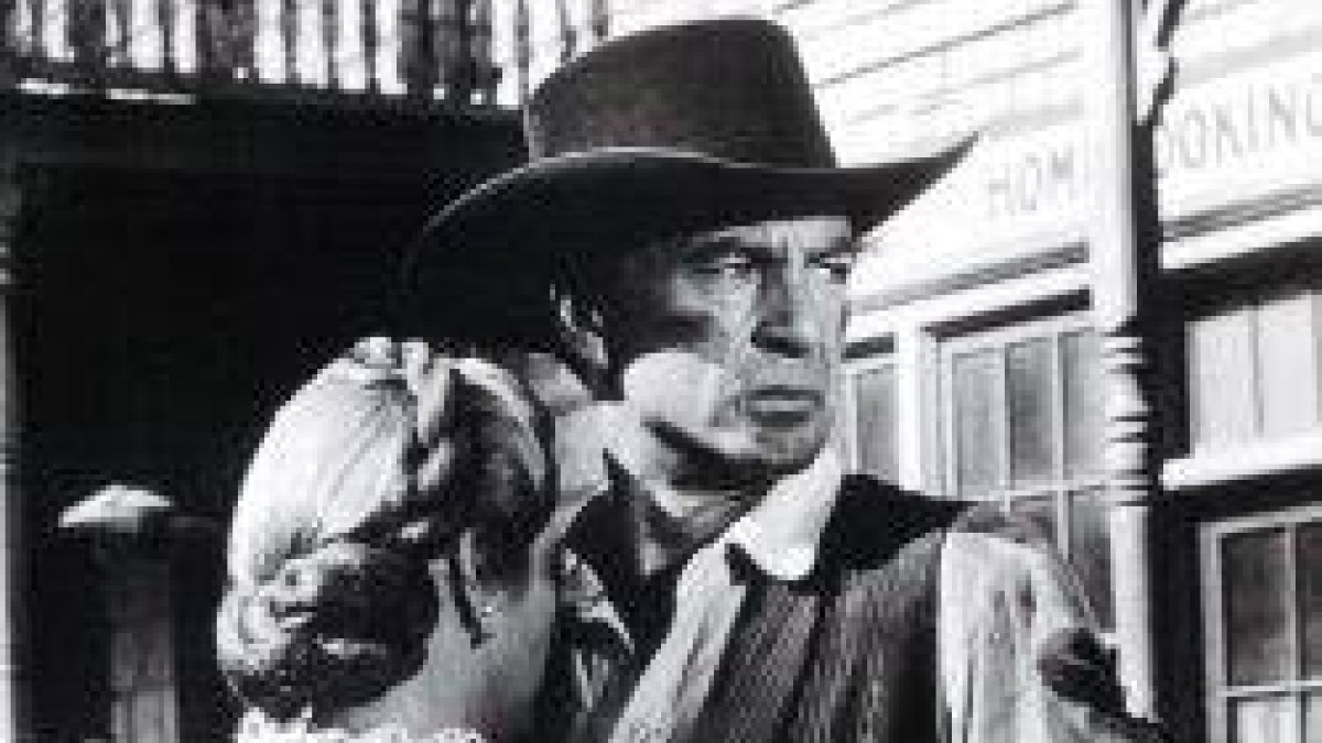 Gary Cooper y Grace Kelly en Solo ante el peligro, 1952... él está mirando hacia algo Más Allá...