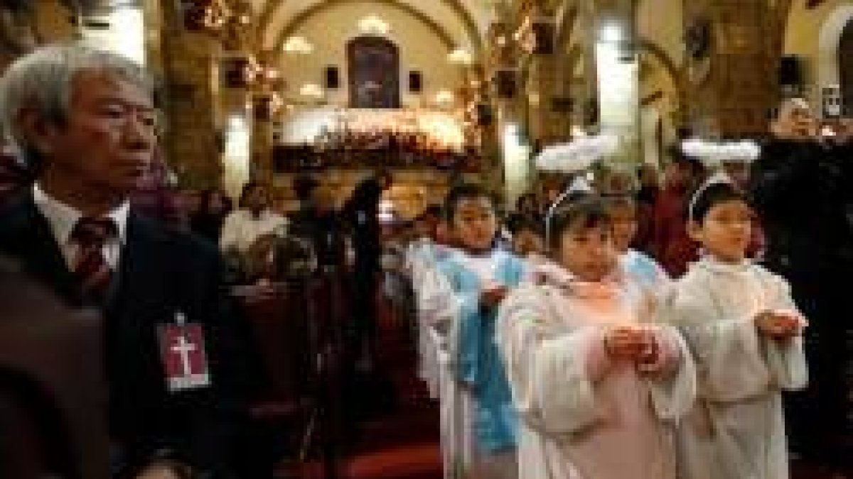 Niños en misa en una parroquia oficial -no clandestina- de Pekín, donde hay algo más de libertad que en otras regiones chinas