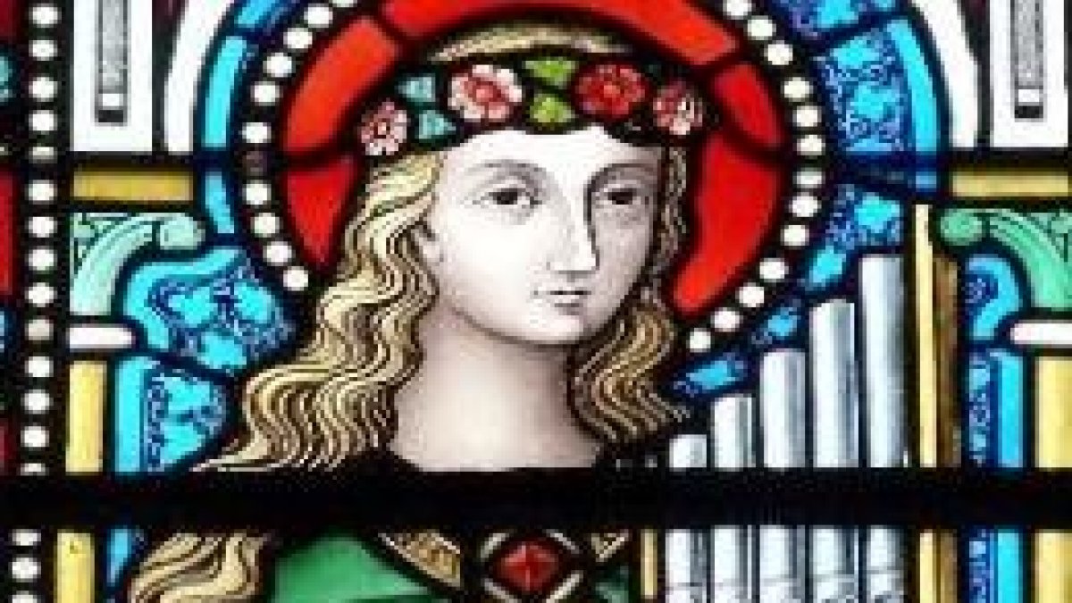 Santa Cecilia con su clásico órgano de tubos, en una vidriera francesa